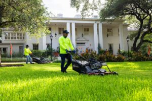 Grass Works Lawn Care crew servicing an Austin-area property
