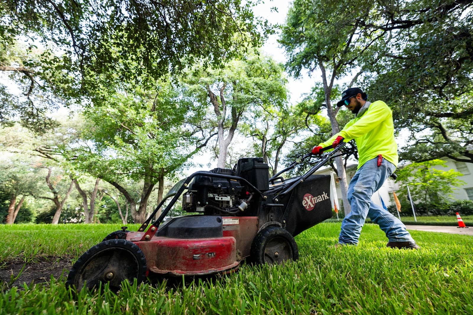 Grass Works Lawn Care team mowing a Central Texas lawn